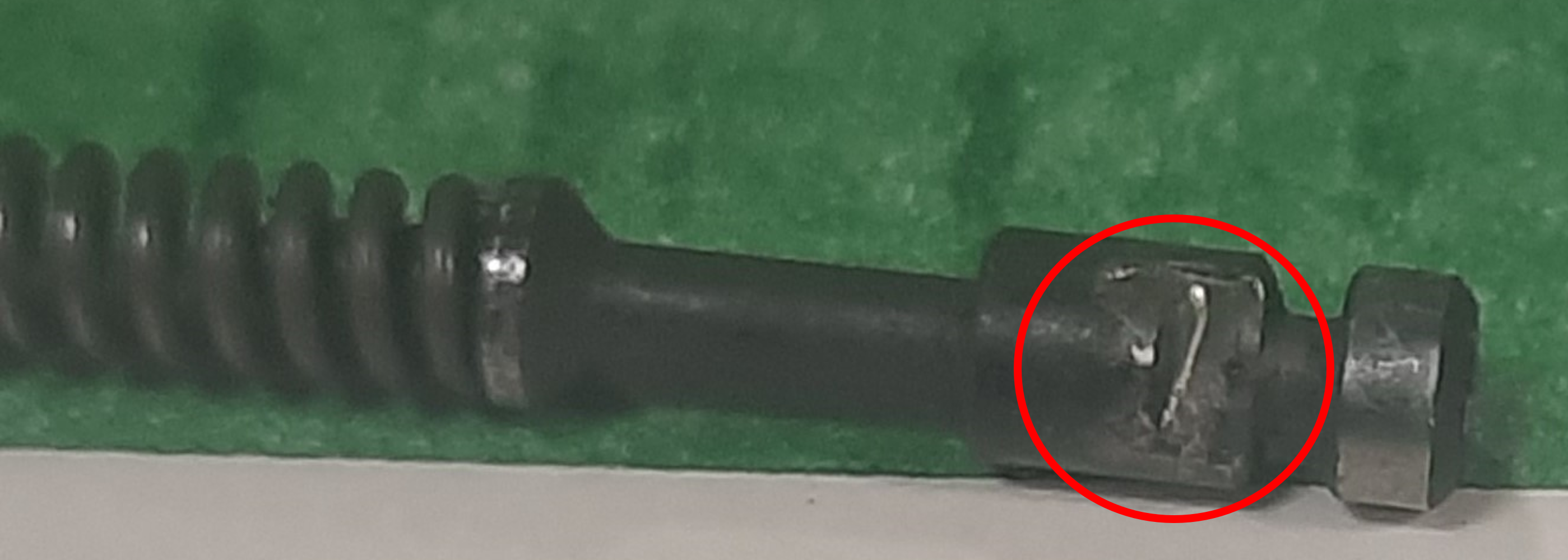Damaged extractor tension pin